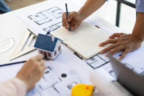 Bushwell Homes design consultation team collaborating on home floor plans and finishes to create a personalized design.
